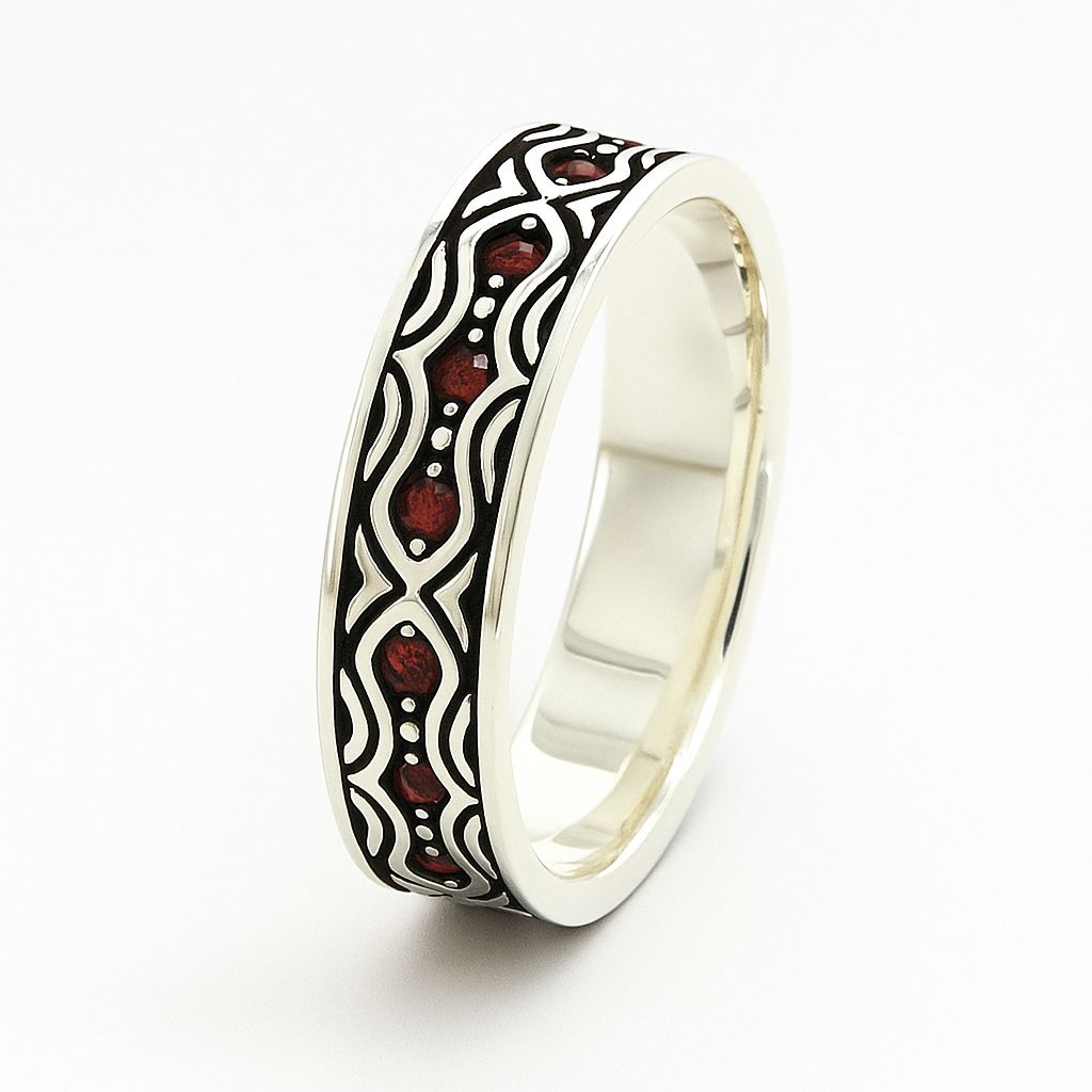 Silver ring with black and red pattern on a white background
