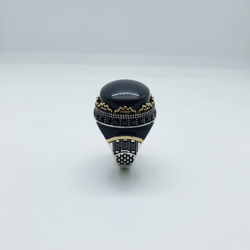 Black ring with gold accents on a white background